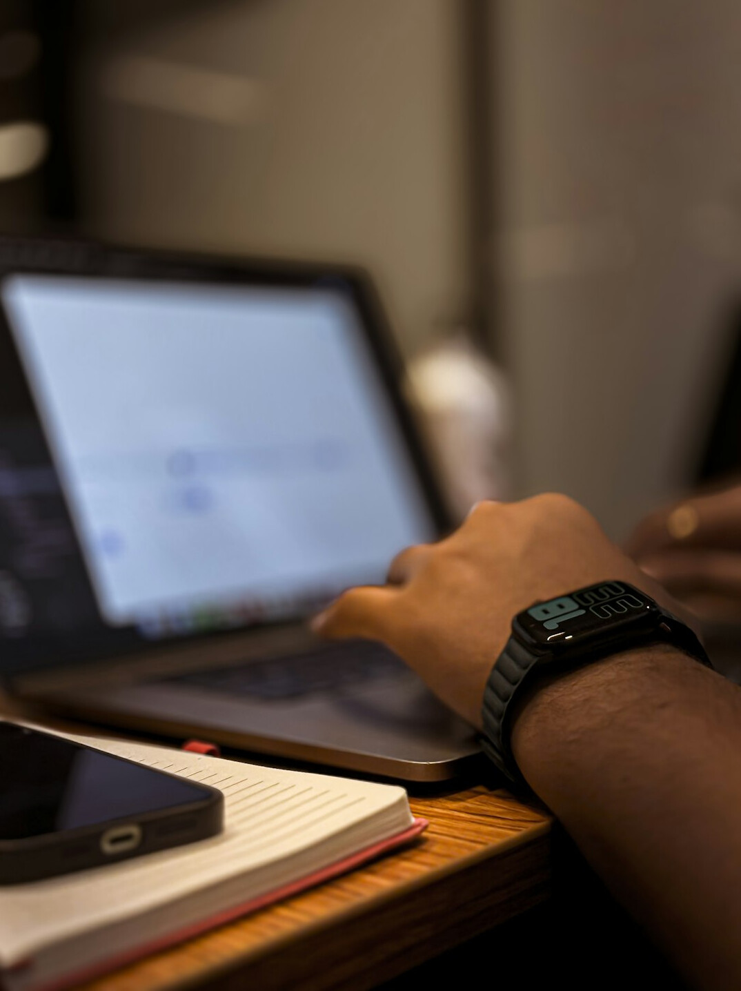 coding on laptop at desk