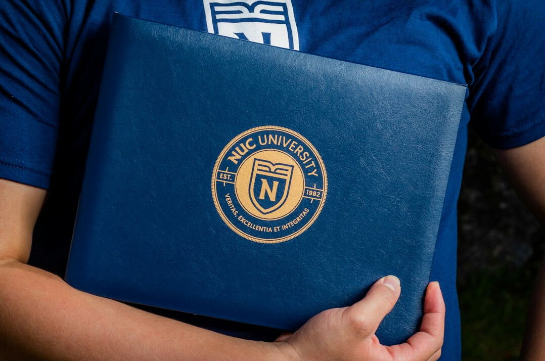 graduation cap on laptop
